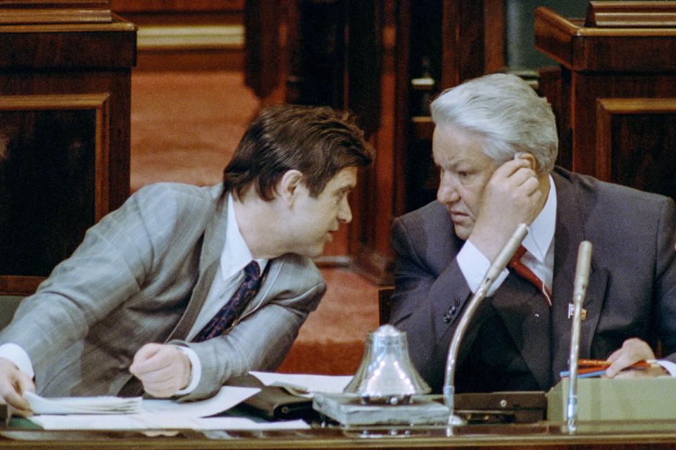 FILE - Russian Federation President Boris Yeltsin listens to Ruslan Khasbulatov, left, Vice President of the Federation, during the Russian Congress which passed a law of presidential power in Moscow, on May 22, 1991. The October 1993 violent showdown between the Kremlin and supporters of the rebellious parliament marked a watershed in Russia's post-Soviet history. (AP Photo/Liu Heung Shing, File)