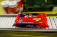 Packaged biscuits move along the production line of Pladis' McVities factory in London Britain, September 19, 2017. Picture taken September 19, 2017. REUTERS/Peter Nicholls.