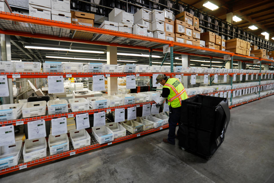 A worker sorts mail in ballots for the March 3 Super Tuesday election at the Orange County Registrar of Voters facilities in  Santa Ana, California, U.S., February 24, 2020. (Mike Blake/Reuters)