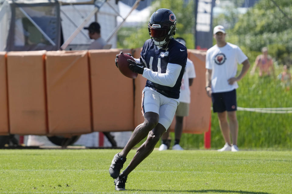 Chicago Bears wide receiver Darnell Mooney catches a ball at the NFL football team’s training camp in Lake Forest, Ill., Thursday, July 27, 2023. (AP Photo/Nam Y. Huh) ORG XMIT: ILNH102