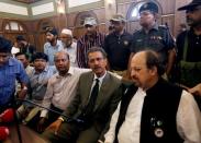 Waseem Akhtar (front row, 2nd R), mayor nominee of Muttahida Qaumi Movement (MQM) political party, waits with others before casting his ballot for mayor at the halls of the Municipal Corporation Building in Karachi, Pakistan, August 24, 2016. REUTERS/Akhtar Soomro?