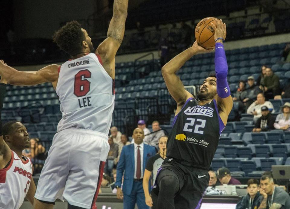 Stockton Kings’ Gabe Vincent, right, shoots over Sioux Falls Skyforce’s Marcus Lee during a G-League game at the Stockton Arena in downtown Stockton on Nov. 13, 2019.