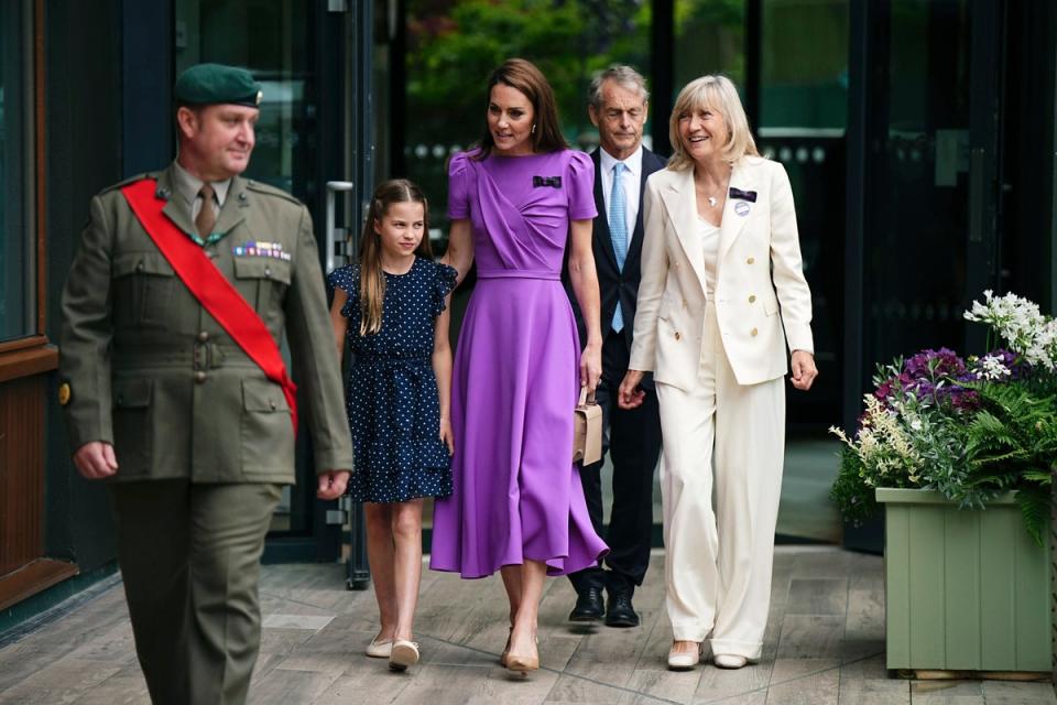 Kate and Charlotte arrive to attend the men's singles final match (PA)