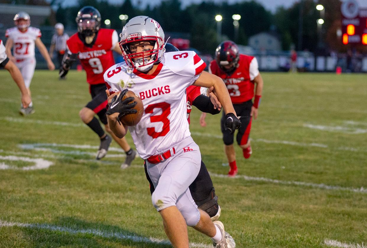 Buckeye Central's Heath Jensen runs the ball after a reception.