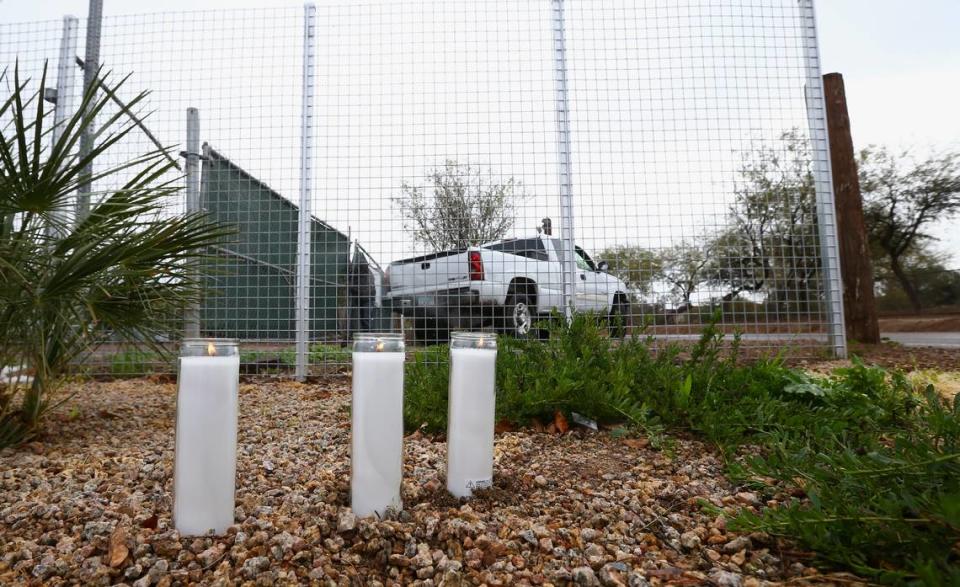 A makeshift memorial is set up near a home where a Phoenix woman was arrested on suspicion of killing her three children after they were found dead inside the family home Tuesday, Jan. 21, 2020, in Phoenix.