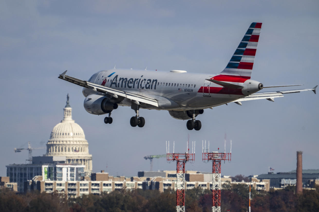 An American Airlines plane lands at Ronald Reagan Washington National Airport November 23, 2021 in Arlington, Virginia. (Photo by Drew Angerer/Getty Images)