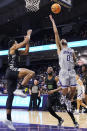 Northwestern guard Boo Buie (0) shoots against Chicago State forward Cameron Jernigan, left, during the first half of an NCAA college basketball game in Evanston, Ill., Wednesday, Dec. 13, 2023. (AP Photo/Nam Y. Huh)