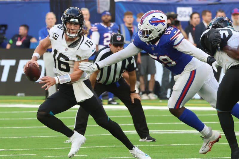 Jacksonville Jaguars quarterback Trevor Lawrence runs away from the Buffalo Bills on Sunday in London. Photo by Hugo Philpott/UPI