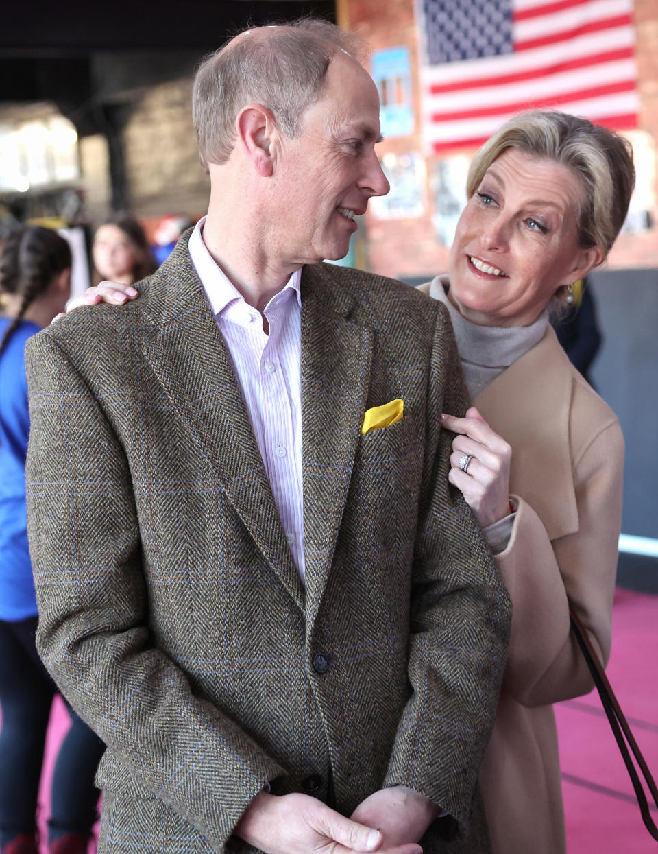 Prince Edward, Duke of Edinburgh and Sophie, Duchess of Edinburgh smile at each other at the Right Stuff Amateur Boxing Club during their visit to Staffordshire on March 05, 2024 in Stafford, England.