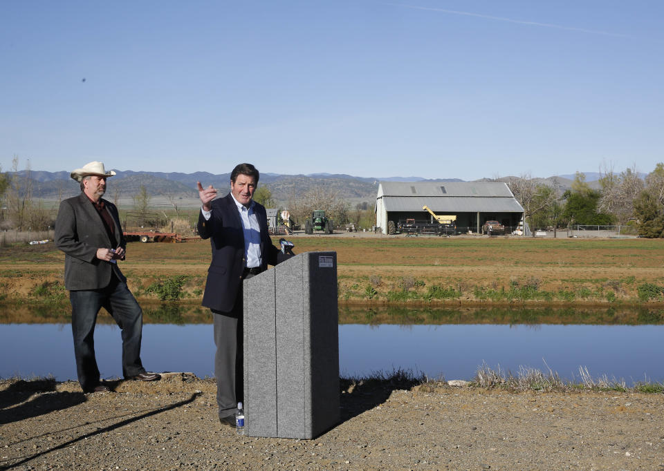 Democratic Rep. John Garamendi, right, gestures as he discusses legislation he and Republican Rep. Doug LaMalfa, left, are proposing to study the cost of building a reservoir in the Sites Valley during a news conference near Maxwell, Calif., Wednesday, March 19, 2014. The proposed measure calls for a federal study of the costs of building a reservoir in a valley about an hour's drive north of Sacramento. The bill would not guarantee federal funding for the reservoir, which is expected to cost between $2 billion and $3 billion dollars. (AP Photo/Rich Pedroncelli)