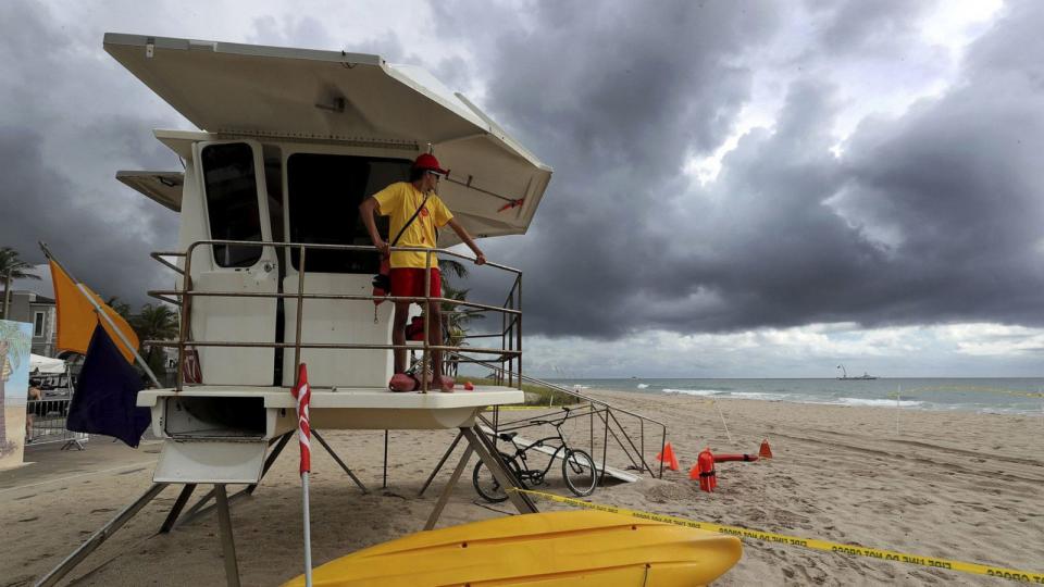 PHOTO: Lifeguard John Canfield looks out at the empty beach as storm clouds roll in on April 30, 2023, in Fort Lauderdale, Florida. (Mike Stocker/South Florida Sun Sentinel/Tribune News Service via Getty Images)