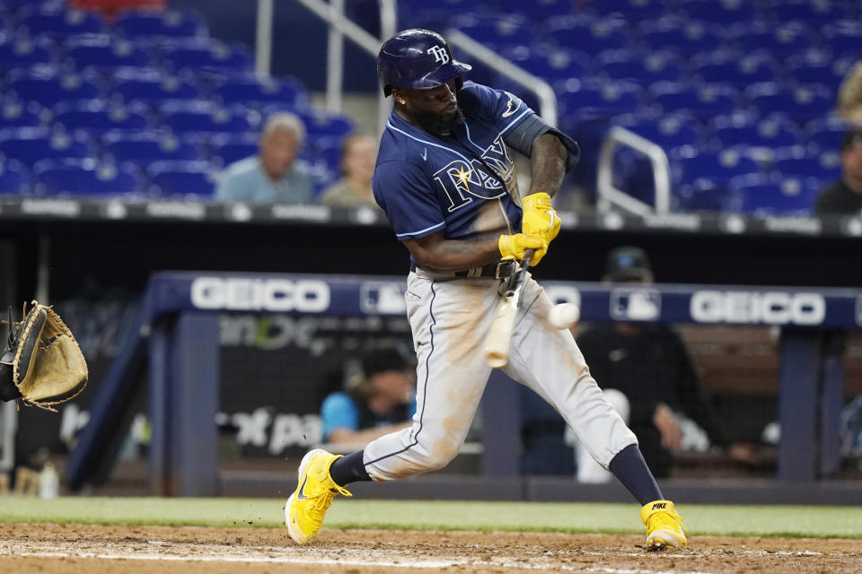 Tampa Bay Rays left fielder Randy Arozarena hits a home run in the ninth inning of a baseball game Miami Marlins, Tuesday, Aug. 30, 2022, in Miami. The Rays defeated the Marlins 7-2. (AP Photo/Marta Lavandier)