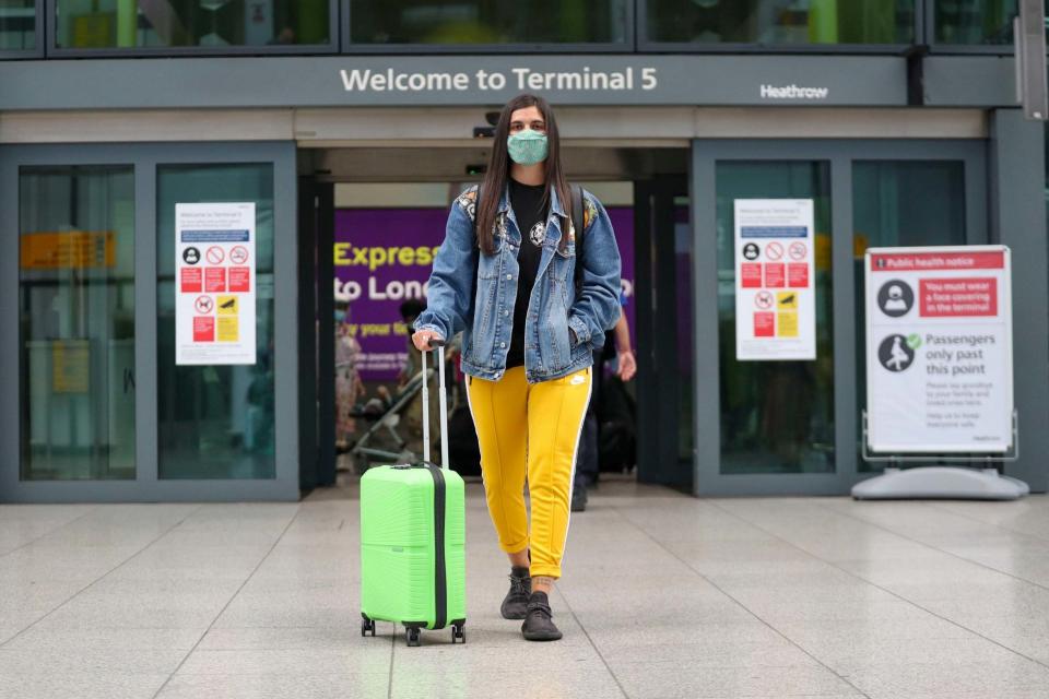 Celia Gonzalez arrives at Heathrow Airport's Terminal 5, after people returning from Spain were told they must quarantine when they return home (PA)