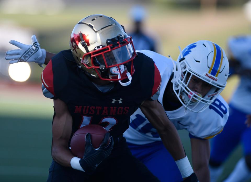 Coronado's Surreal Garrett, left, runs as Frenship's Xavier Frost, right, prepares to tackle, Thursday, Aug. 25, 2022, Lowrey Field at PlainsCapital Park. Coronado won, 20-14.