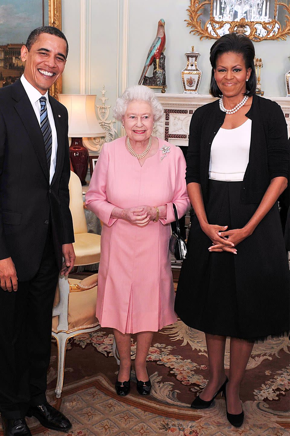 <p>Touching members of the royal family is a big no-no, <em>especially</em> when it comes to Her Majesty. But when the matriarch met former First Lady Michelle Obama, Elizabeth appeared to fan girl just as hard as anyone would. The Queen uncharacteristically slung her arm around Obama during their photo op (which you can see for yourself, <a href="https://www.youtube.com/watch?v=eU_0hyjXRaM" rel="nofollow noopener" target="_blank" data-ylk="slk:here;elm:context_link;itc:0;sec:content-canvas" class="link ">here</a>).</p>