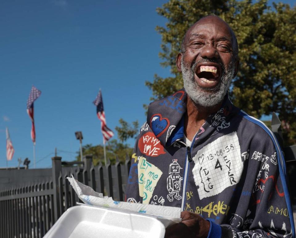 A parade attendee smiles with glee while watching the parade on the 1300 block of Northwest 54th Street in Miami. The 45th Annual MLK Parade traveled westbound on Northwest 54th Street starting on 12th Avenue featuring college and high school marching bands, politicians, City of Miami mounted police and motor units, police color guards, city and county fire/rescue trucks, Miami-Dade transit workers, and others on Monday, Martin Luther King Jr. Day, Jan. 17, 2022.