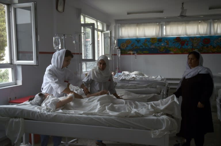 Wounded Afghan students from the American University receive treatment in Kabul on August 25, 2016