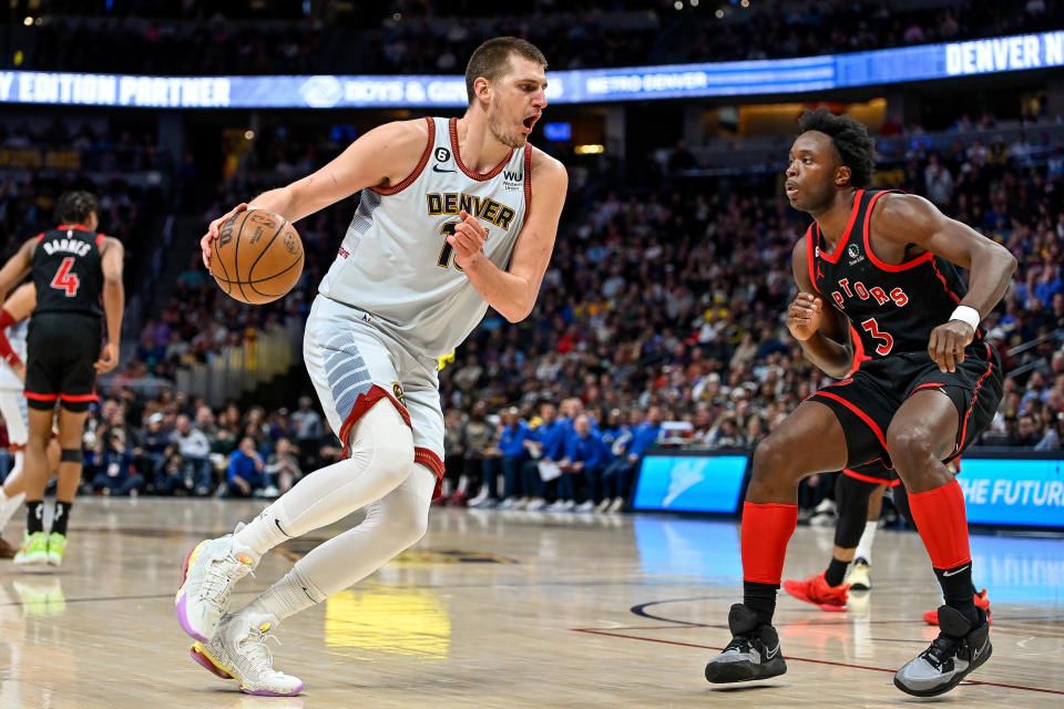 DENVER, CO - MARCH 6:  Nikola Jokic #15 of the Denver Nuggets is defended by O.G. Anunoby #3 of the Toronto Raptors in a game at Ball Arena on March 6, 2023 in Denver, Colorado. NOTE TO USER: User expressly acknowledges and agrees that, by downloading and or using this photograph, User is consenting to the terms and conditions of the Getty Images License Agreement. (Photo by Dustin Bradford/Getty Images)