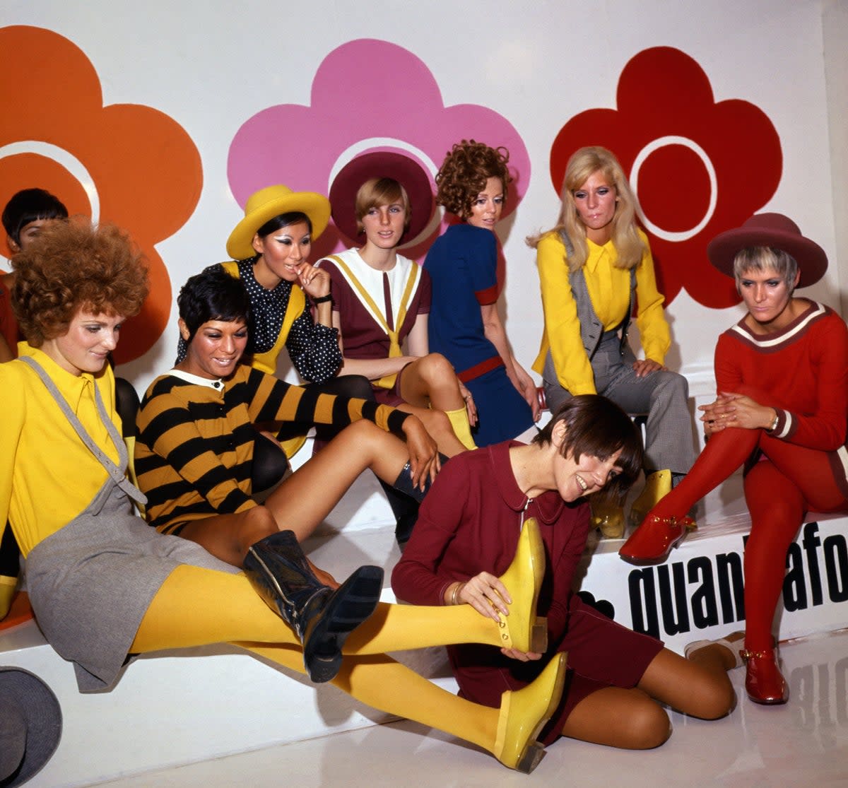 Mary Quant (foreground) with models showing her new shoe creations in 1967 (PA)