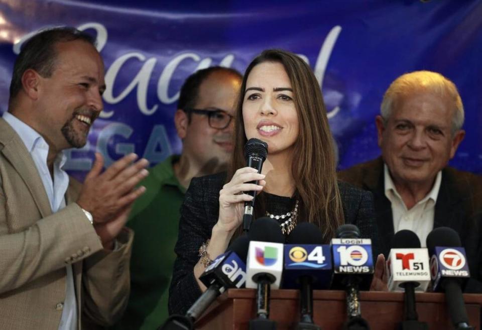 Raquel Regalado stands with brothers Tommy Regalado, left, and Jose Regalado, back, and father, Tomás Regalado, right, after making the runoff election for county mayor in 2016.