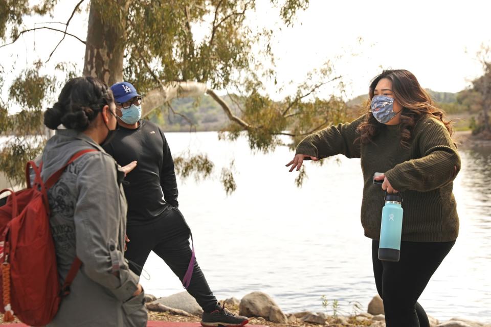 Kaitlyn Nguyen, right, hikes with friends