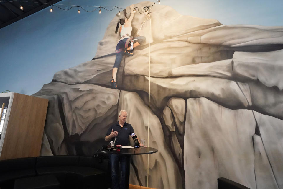 Ted Henifin, interim water manager, for JXN Water, the water system for the city of Jackson, Miss., stands before a rock climbing mural in the agency's office as he explains his agency's preparation for cold weather during a news conference, Friday, Jan. 12, 2024, in Jackson. Henifin also questioned the Mississippi Department of Health's recent results regarding the quality of the city's water. (AP Photo/Rogelio V. Solis)