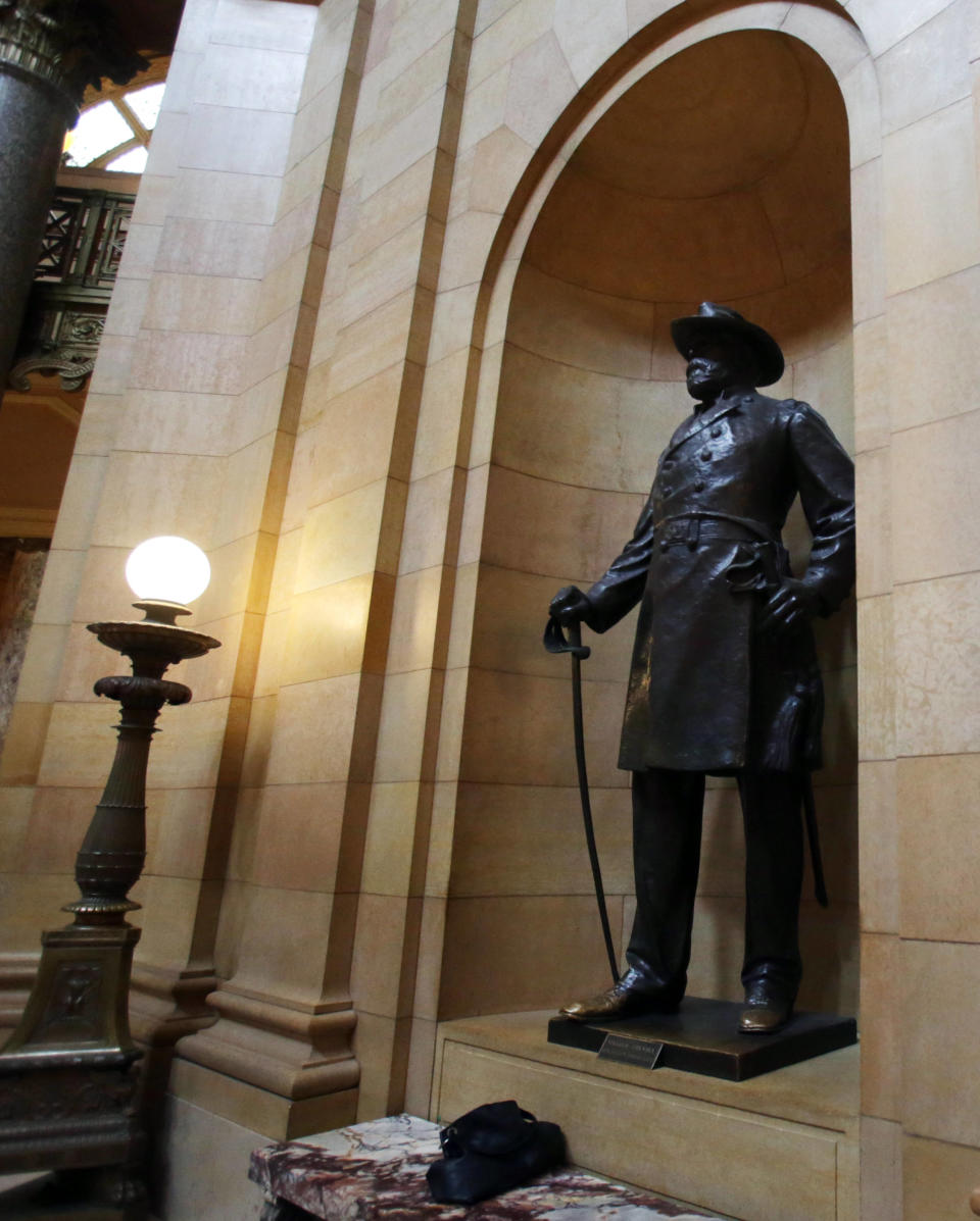 In this March 6, 2014 photo, a statue of William Colvill, Col. 1st Regiment Minnesota Volunteers, stands at the Minnesota State Capitol in St. Paul, Minn. Beginning in the spring, work crews will take down paintings and sculpture and cover murals and statues as the renovation continues on the century old building. Some lawmakers hope to update the collection while others are committed to leaving it unchanged. (AP Photo/Jim Mone)