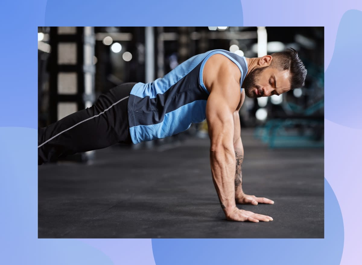 fit, muscular man doing pushups at the gym