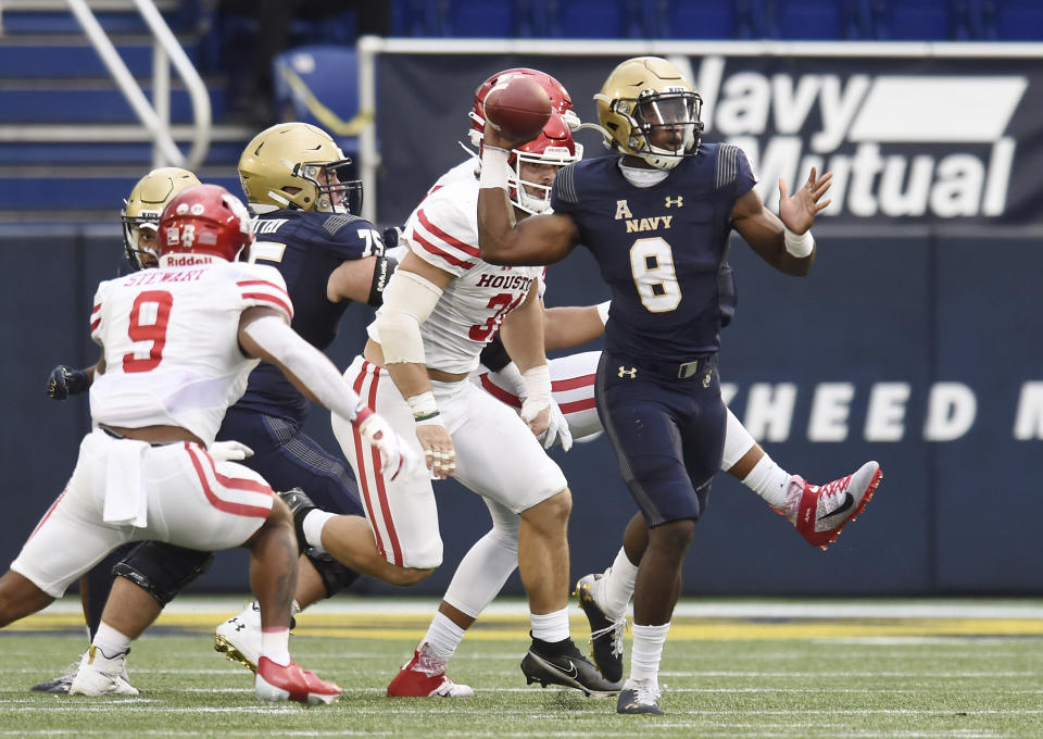 Navy quarterback Dalen Morris (8) attempts a pass against Houston in the second quarter of an NCAA college football game in Annapolis, Md., Saturday, Oct. 24, 2020. (Paul W. Gillespie/The Baltimore Sun via AP)