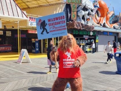 A costumed figure on the boardwalk promotes Seaquatch for President hours before Donald Trump's appearance in Wildwood on Saturday, May 11.