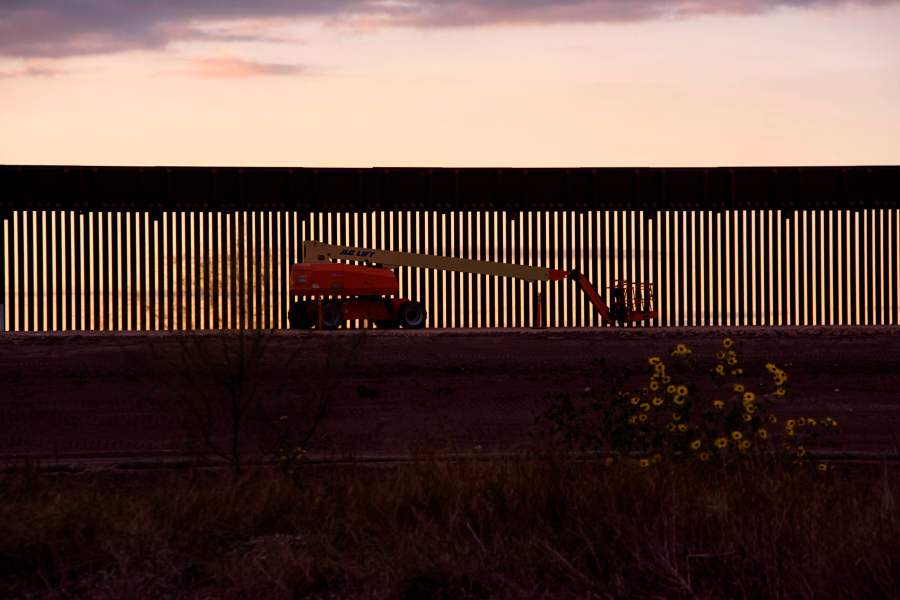 A mechanical lift sits next to a section of newly constructed border wall in Hidalgo, Texas on January 11, 2021. (Photo by MARK FELIX/AFP /AFP via Getty Images)
