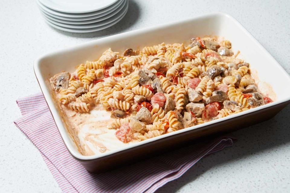 <p>Cherry tomatoes and mushrooms bake along with goat cheese to form the base of the sauce that cooks the pasta right in the baking dish—no stovetop required.</p> <p> <a href="https://www.eatingwell.com/recipe/7897173/baked-tomato-mushroom-goat-cheese-pasta/" rel="nofollow noopener" target="_blank" data-ylk="slk:View Recipe;elm:context_link;itc:0;sec:content-canvas" class="link ">View Recipe</a></p>