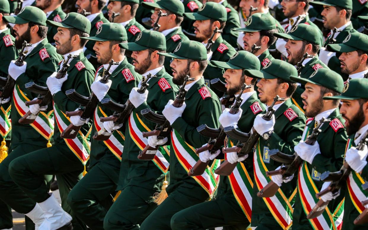 The elite guard is in charge of Iran's ballistic missiles and nuclear programmes - AFP