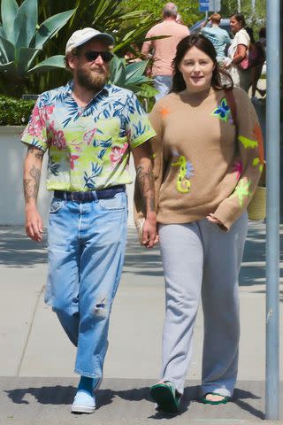 Jonah Hill and Girlfriend Olivia Millar Step Out in Coordinating Colorful  Looks Following the Birth of Their First Baby