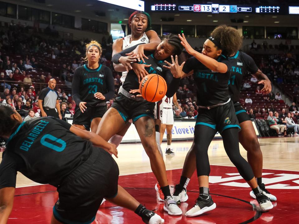 Aliyah Boston gets swarmed by Coastal Carolina's defense.