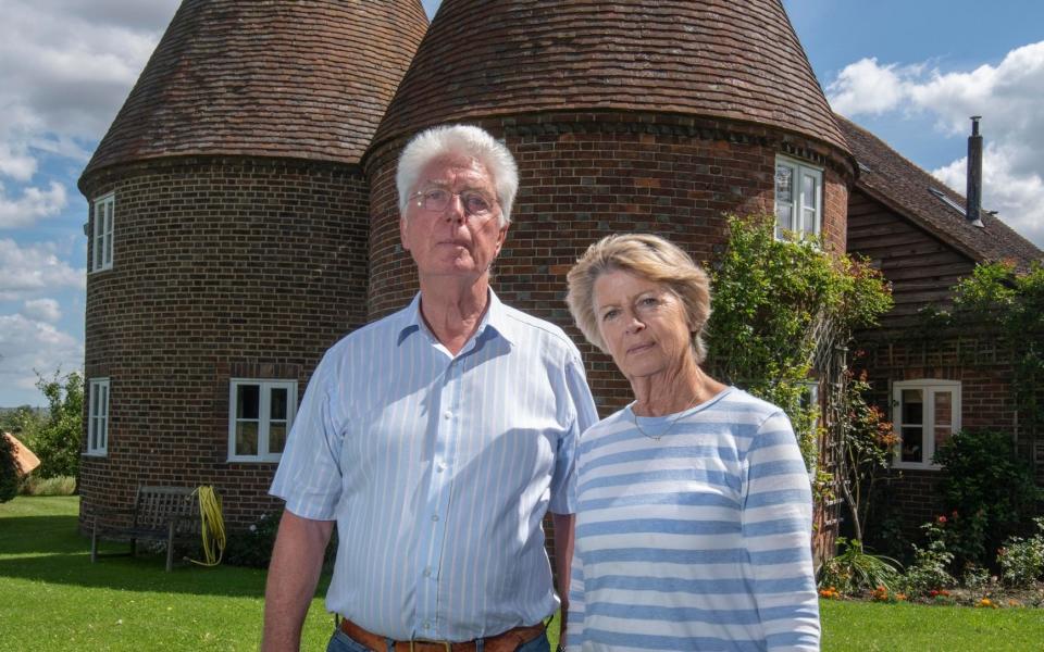 Mr Pattenden, pictured with his wife Angela outside their home, said: "We are not NIMBYist and are more than happy to have housing here." But he believes there are better-suited brownfield sites - Julian Simmonds 