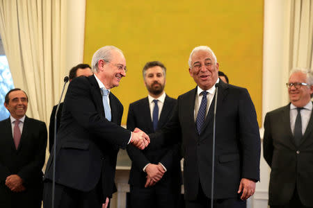 Portugal's Prime Minister Antonio Costa (R) shakes hands with Social Democratic Party (PSD) leader Rui Rio at the Sao Bento Palace in Lisbon, Portugal April 18, 2018. REUTERS/Rafael Marchante