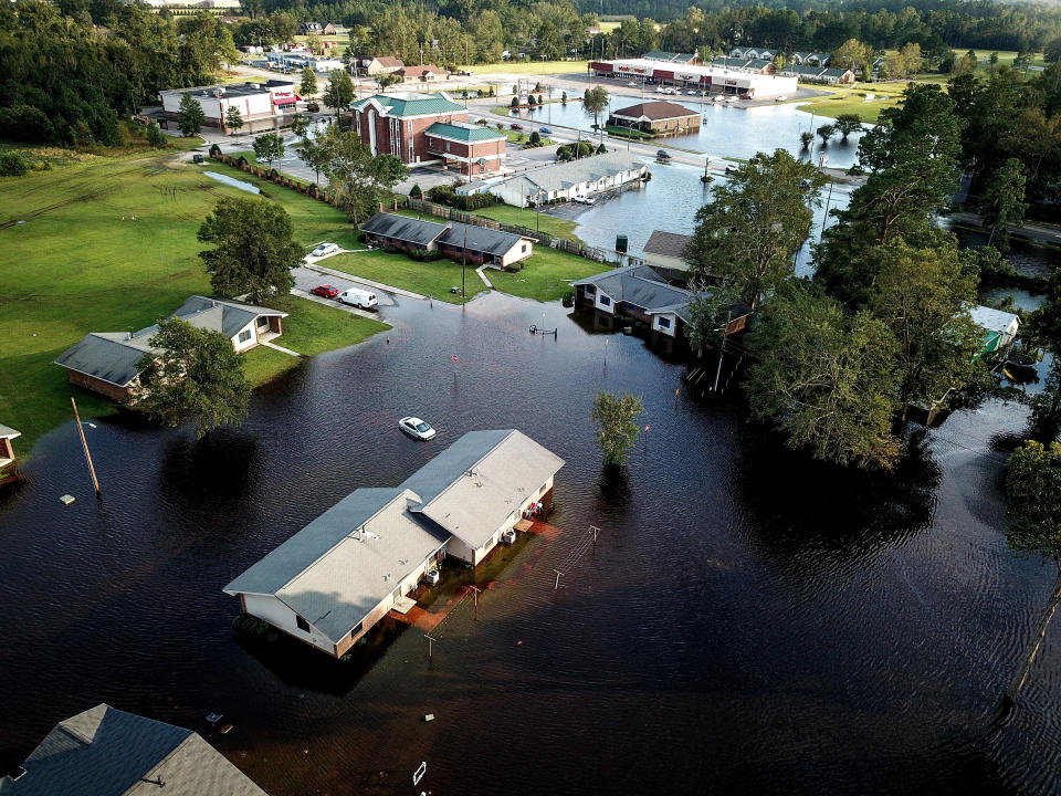 A flooded neighborhood stands next to the Lumber River in Pembroke, North Carolina.&nbsp;