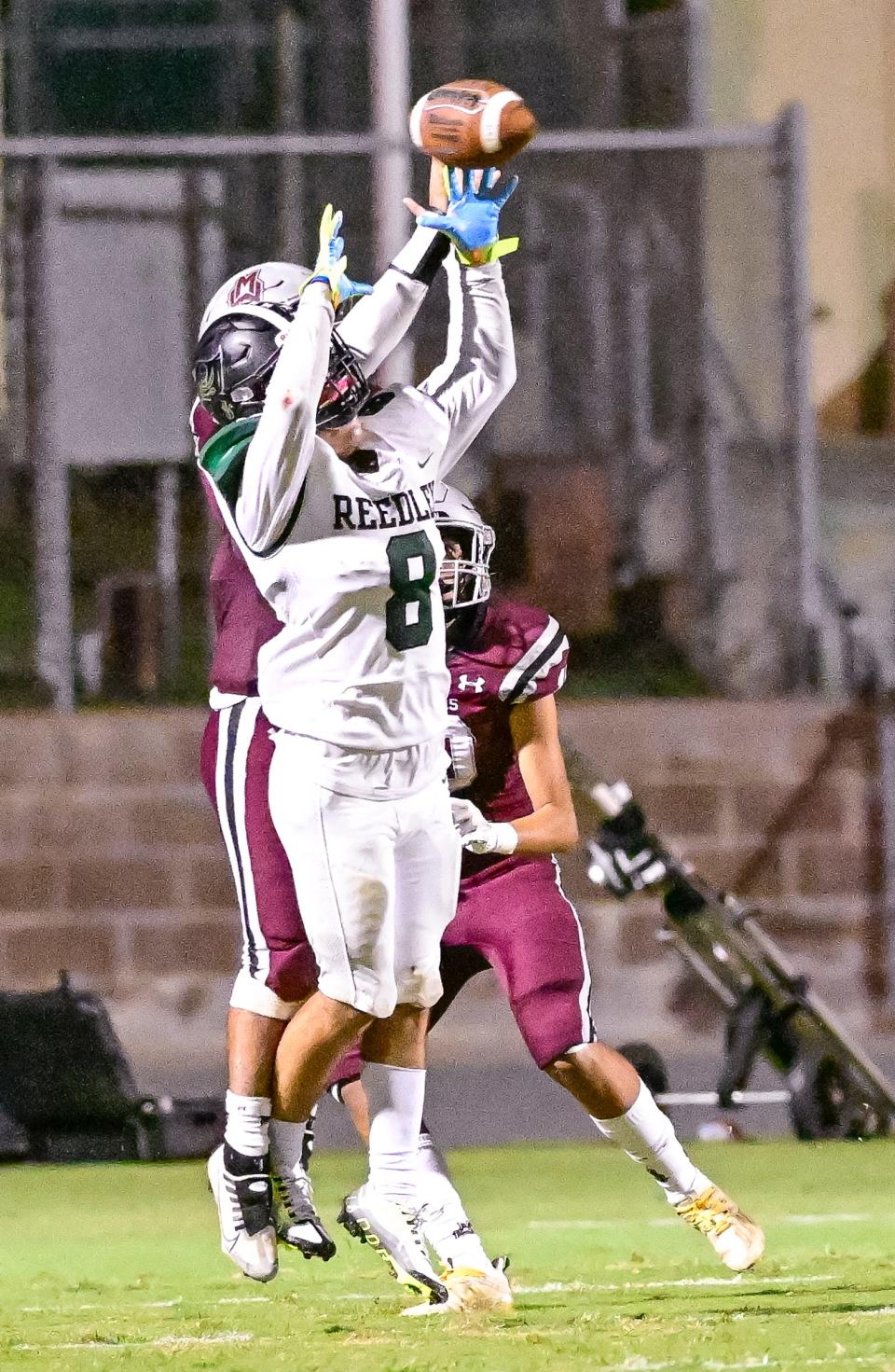 Mt. Whitney's Mario Rodriguez breaks up a pass intended for Reedley's Jayden Galvan in a non-league high school football game on Friday, September 23, 2022. 