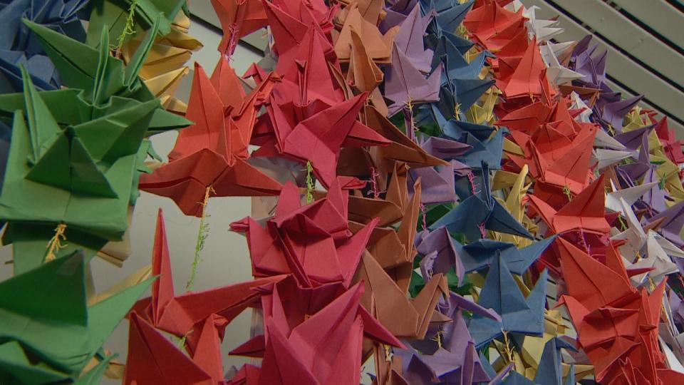 The members of Link CC started folding the paper cranes during summer camp.