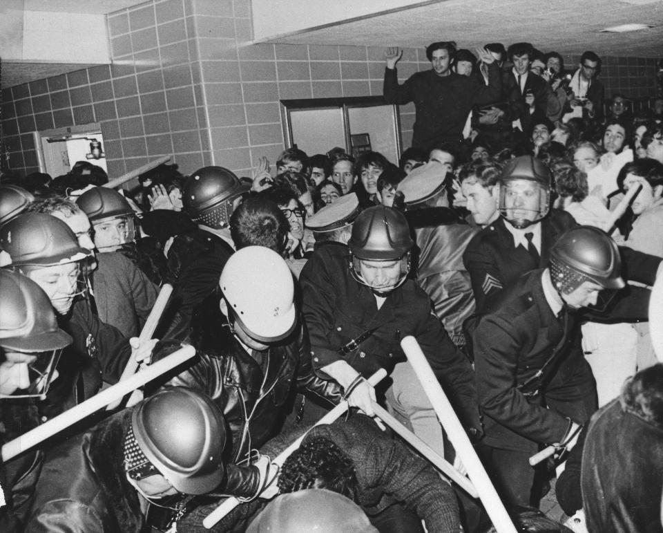 FILE - Police use tear gas and night sticks to break up anti- Vietnam war demonstrations at the University of Wisconsin campus in Madison, Oct. 18, 1967. Colleges and universities have long been protected places for free expression without pressure or punishment. But protests over Israel's conduct of the war in Gaza in its hunt for Hamas after the Oct. 7 massacre has tested that ideal around the world. The crackdowns are reviving memories of student-led protests during the American civil rights movement, the Vietnam War and the pro-democracy demonstrations in Beijing’s Tiananmen Square. (AP Photo/Neal Ulevich, File)