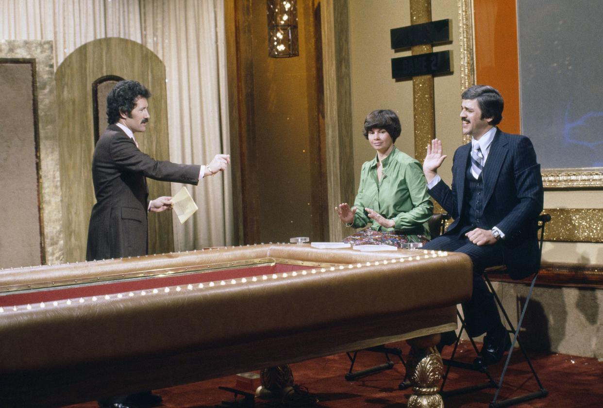 "High Rollers" was Trebek's, seen here with contestants from the show, second on-air hosting gig after moving to the U.S. from Canada. He first hosted "The Wizard of Odds" a year prior.