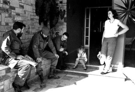 (L-R) Manuel Pineiro, Fidel Castro, Raul Castro, an unidentified girl and Vilma Espin together in Havana in this undated file photo. REUTERS/ Prensa Latina