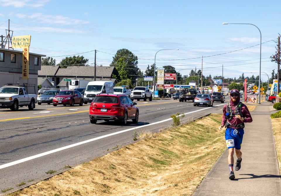 Greg Nance jogs in scenic Parkland, Washington, on July 15.