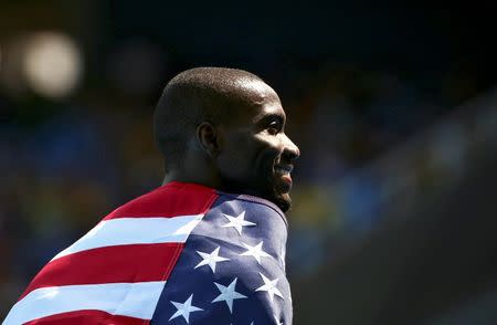 2016 Rio Olympics - Athletics - Final - Men's 400m Hurdles Final - Olympic Stadium - Rio de Janeiro, Brazil - 18/08/2016. Kerron Clement (USA) of USA celebrates winning the gold medal. REUTERS/Alessandro Bianchi