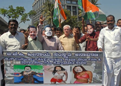 Members of the Karnataka State Youth Congress protest against the three state ministers from the right-wing Bharatiya Janata Party (BJP) who were accused of watching porn in the local assembly