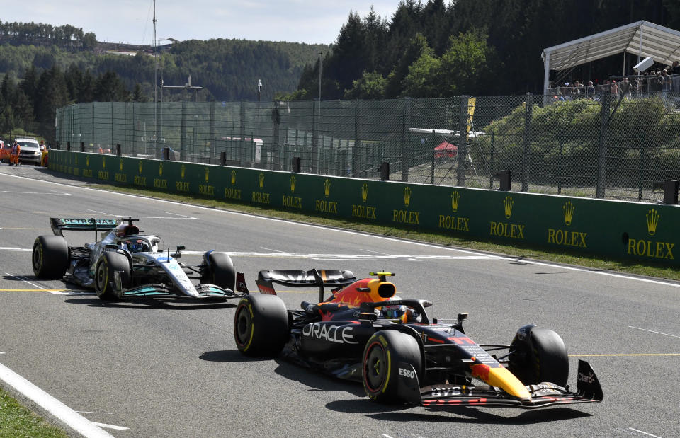 Red Bull driver Sergio Perez of Mexico, right, steers his car during the Formula One Grand Prix at the Spa-Francorchamps racetrack in Spa, Belgium, Sunday, Aug. 28, 2022. (AP Photo/Geert Vanden Wijngaert, Pool)