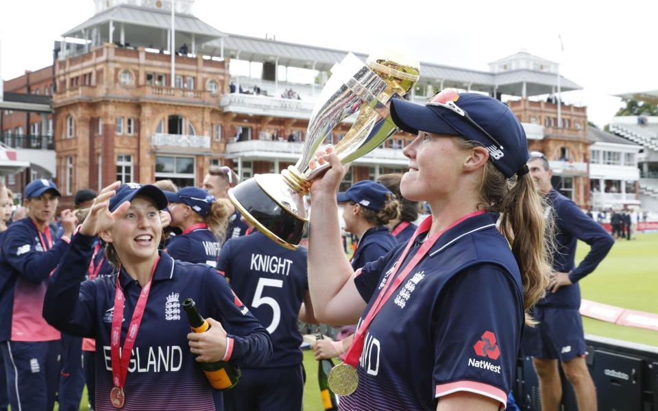 Anya Shrubsole raises the trophy - AFP