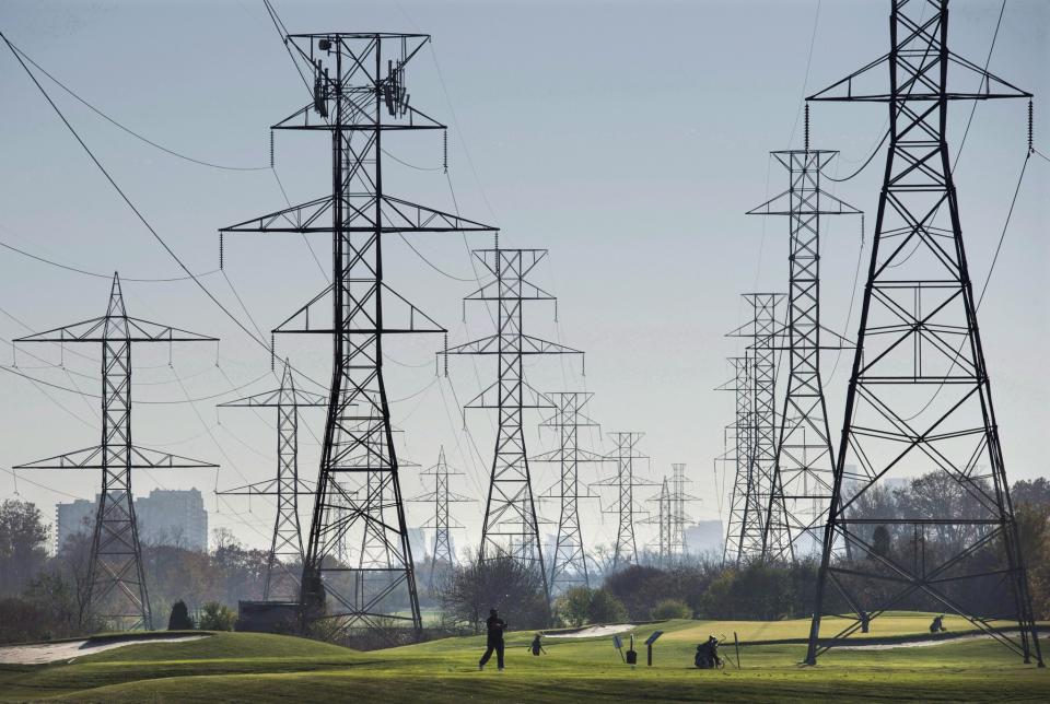 Hydro towers are seen over a golf course in Toronto on Wednesday, November 4, 2015. (THE CANADIAN PRESS/Darren Calabrese)