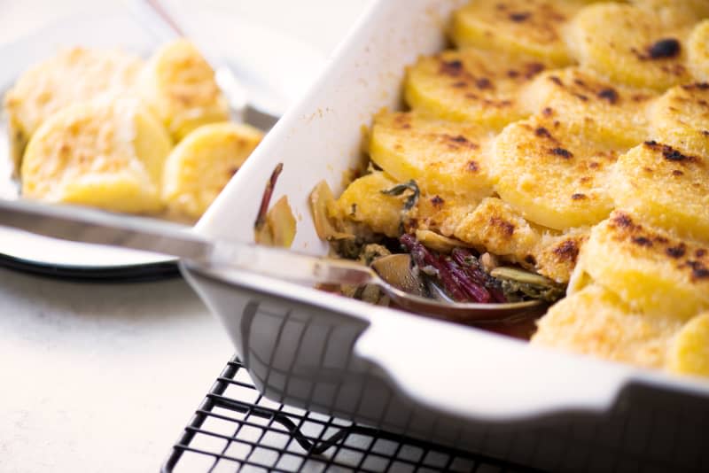 Baked Polenta with Greens, Artichokes, and Gruyère